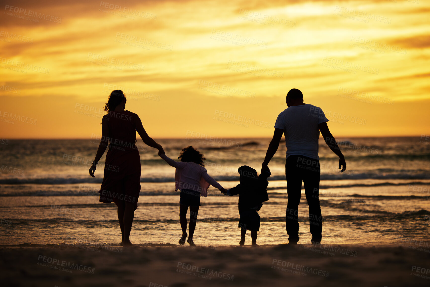 Buy stock photo Family, holding hands and silhouette at the beach at sunset, adventure and love with parents and children outdoor. Mother, father and kids together, trust and freedom by the ocean, nature and care.