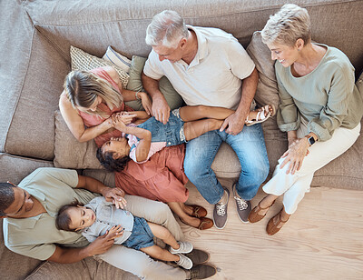 Buy stock photo Interracial family, fun and sofa in a home living room with a happy mom, grandparents and children. Top view of happiness, smile and kids bonding with elderly people, mother and dad on a house couch