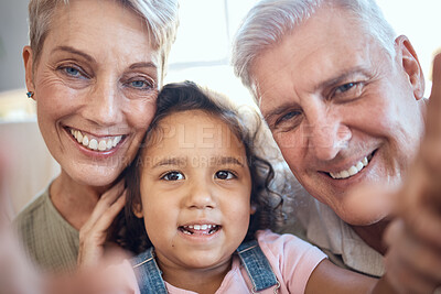 Buy stock photo Interracial family, selfie and girl with grandparents at home feeling happy with love and care. Portrait of senior people with an adopted kid bonding together at a house busy with youth care 