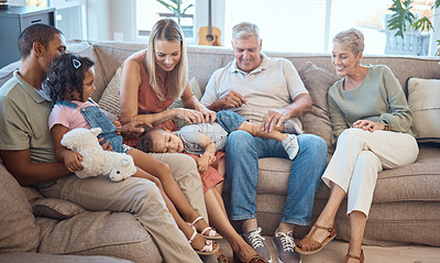 Buy stock photo Big family, happiness and love on house sofa with children, parents and grandparents together for bonding, quality time and relax. Happy kids, women and men in interracial family home in Europe 