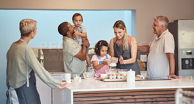 Buy stock photo Big family, cooking and baking in home kitchen for bonding, learning and help while making food and teaching skills with children, parents and grandparents. Men, women and children together to bake