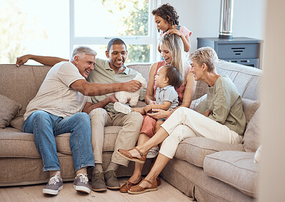 Buy stock photo Happy, love and big family relaxing on sofa together in the living room of their house. Happiness, grandparents and parents with children playing, bonding and resting in lounge of their modern home.