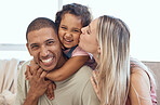 Happy family smile, hug and cheek kiss in joyful happiness for quality bonding time together on living room sofa at home. Portrait of father, mother and kid smiling, hugging or enjoying relationship