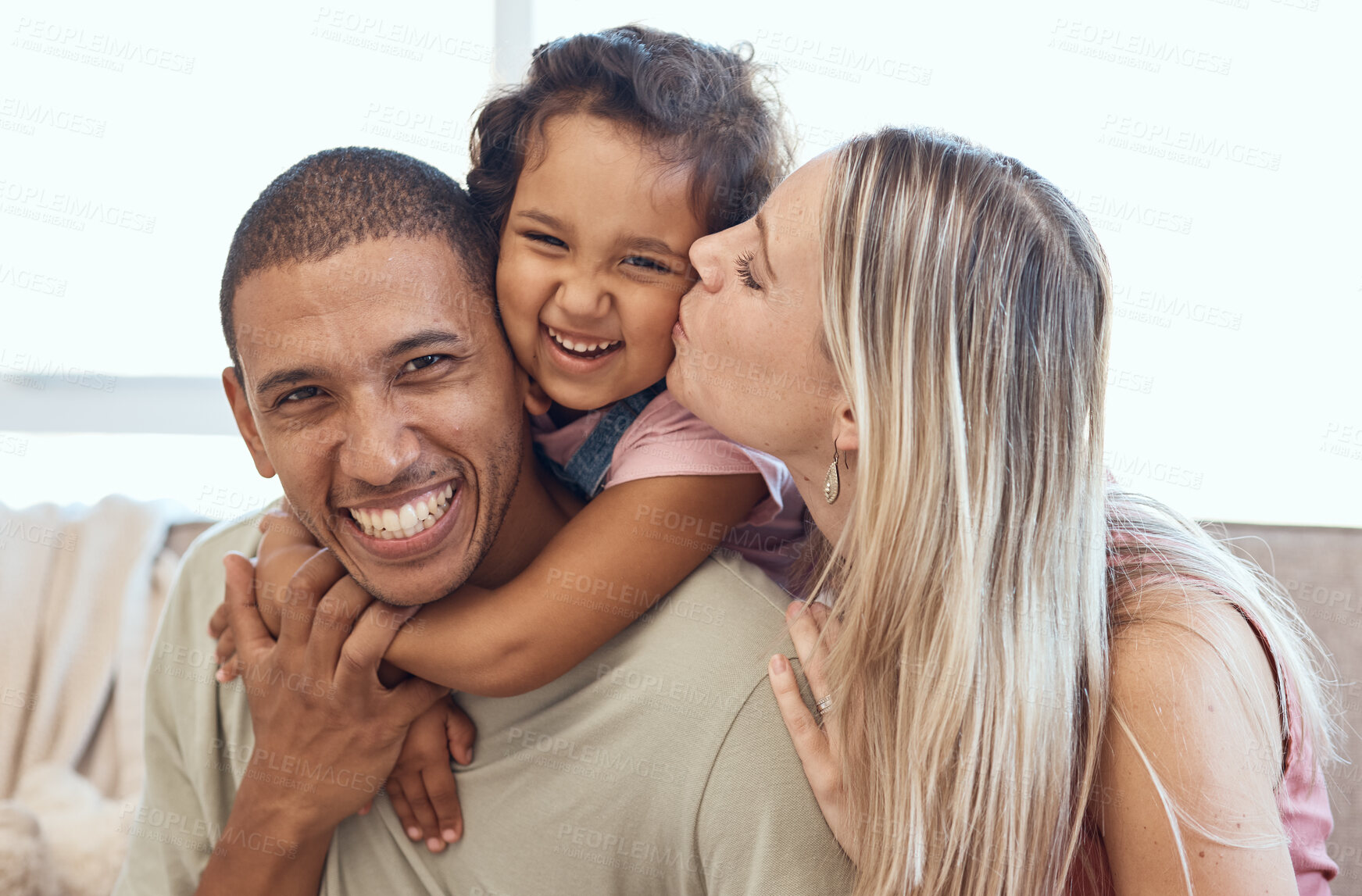 Buy stock photo Happy family smile, hug and cheek kiss in joyful happiness for quality bonding time together on living room sofa at home. Portrait of father, mother and kid smiling, hugging or enjoying relationship
