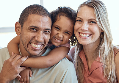 Buy stock photo Multicultural parents child, portrait on sofa and happy mom and dad smile together in home while bonding love. Black man, woman and daughter girl with diversity, relax and hug on couch in house