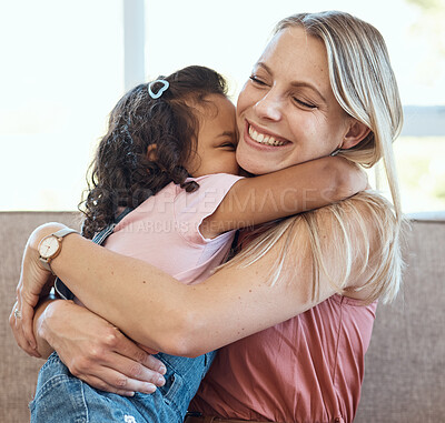 Buy stock photo Mother, hug and child love on a home living room sofa feeling interracial family and kid care. Mama, happy girl and parent loving her kid with a smile on a house lounge couch hugging in a family home