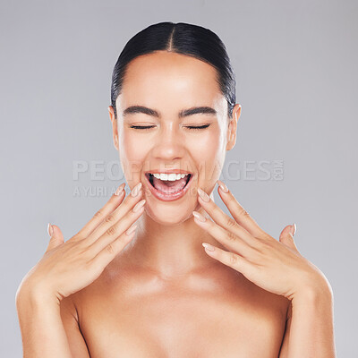 Buy stock photo Woman, smile and hands in beauty for skincare, cosmetics or makeup treatment against a grey studio background. Excited happy female smiling with teeth in satisfaction for perfect luxury cosmetic care