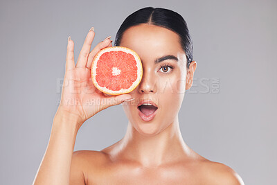 Buy stock photo Woman, natural beauty and grapefruit skincare treatment for organic treatment for natural, healthy and clean hygiene product. Surprise, wow and happy face of cosmetics model  in studio background
