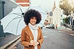 Woman, fashion and umbrella portrait in winter city while travelling and sightseeing. Tourist, style and happy young female student commuting in an urban town in cold weather during autumn 