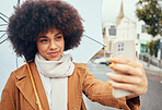 Travel, woman or phone selfie with umbrella in New York city on social media review, video call or live streaming on content creator vlog. Happy, smile or afro influencer on vlogger mobile technology