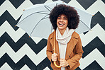 Creative, fashion and black woman with umbrella in city standing by black and white pattern wall. Beauty, happiness and girl enjoying weekend, freedom and holiday in urban town by monochrome design