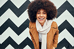 Black woman afro, happy against background and smile for beauty, hair care and fashion portrait. Woman, happiness and african hair against art wall in urban, city or metro with winter clothes style