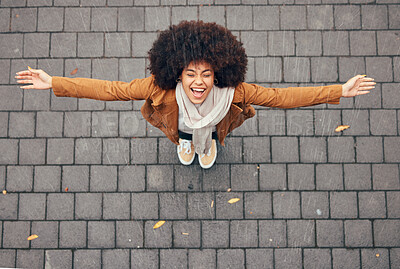 Buy stock photo Rain, happy and woman in city during winter standing outdoor in town with smile and joy. Happiness, freedom and excited girl from Mexico with an afro enjoying the drops of water outside in urban area
