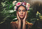 Beauty, jungle and flowers with portrait of woman for tropical or exotic skincare, makeup and cosmetics. Summer, spa and nature with model and crown of rose in forest for salon, plant and luxury