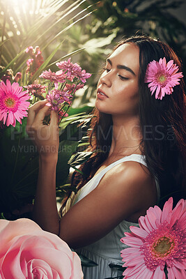 Buy stock photo Flowers, gardening and woman in a forest, nature or park for peace, zen or wellness. Spring, plants and model in a garden with an aster flower and floral natural environment with trees in summer