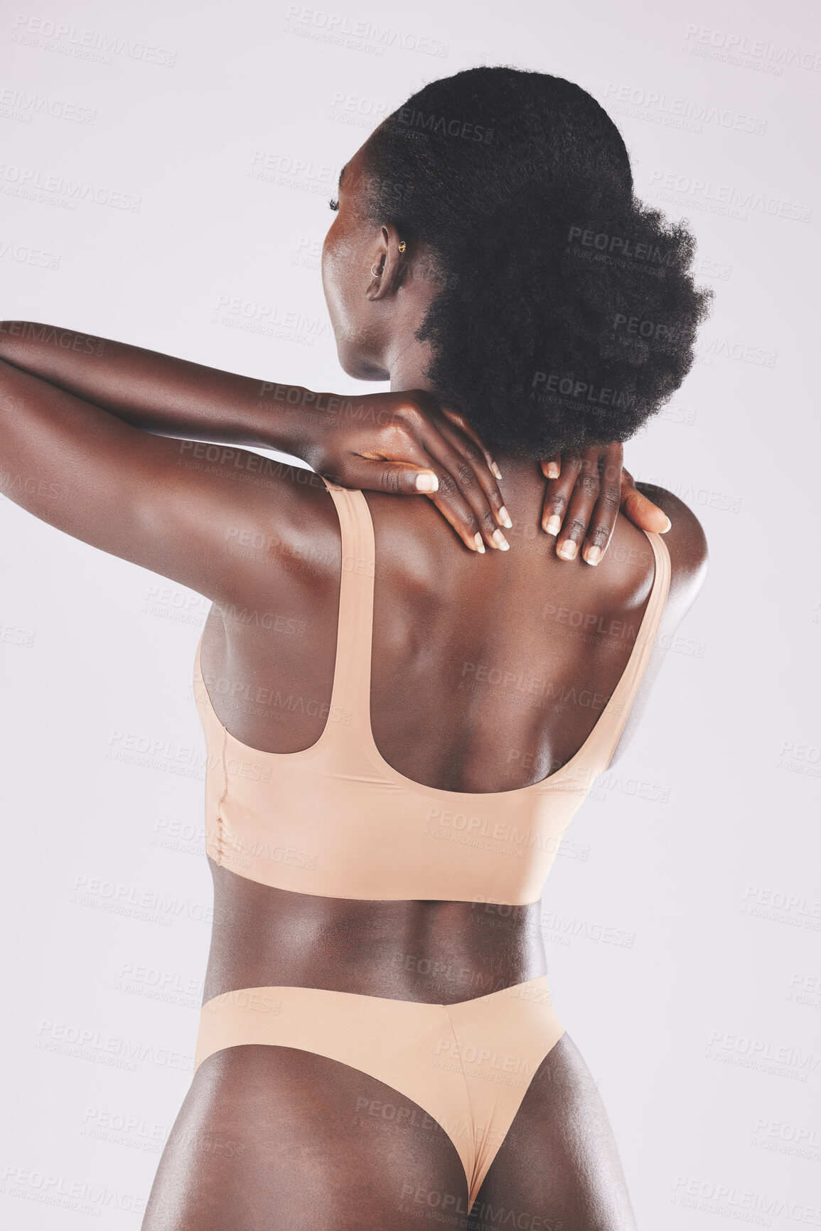 Buy stock photo Beauty, back and lingerie by black woman in studio for skincare, grooming and hygiene on a grey background. Wellness, girl and nigerian model relax with pamper, massage and skin treatment with mockup