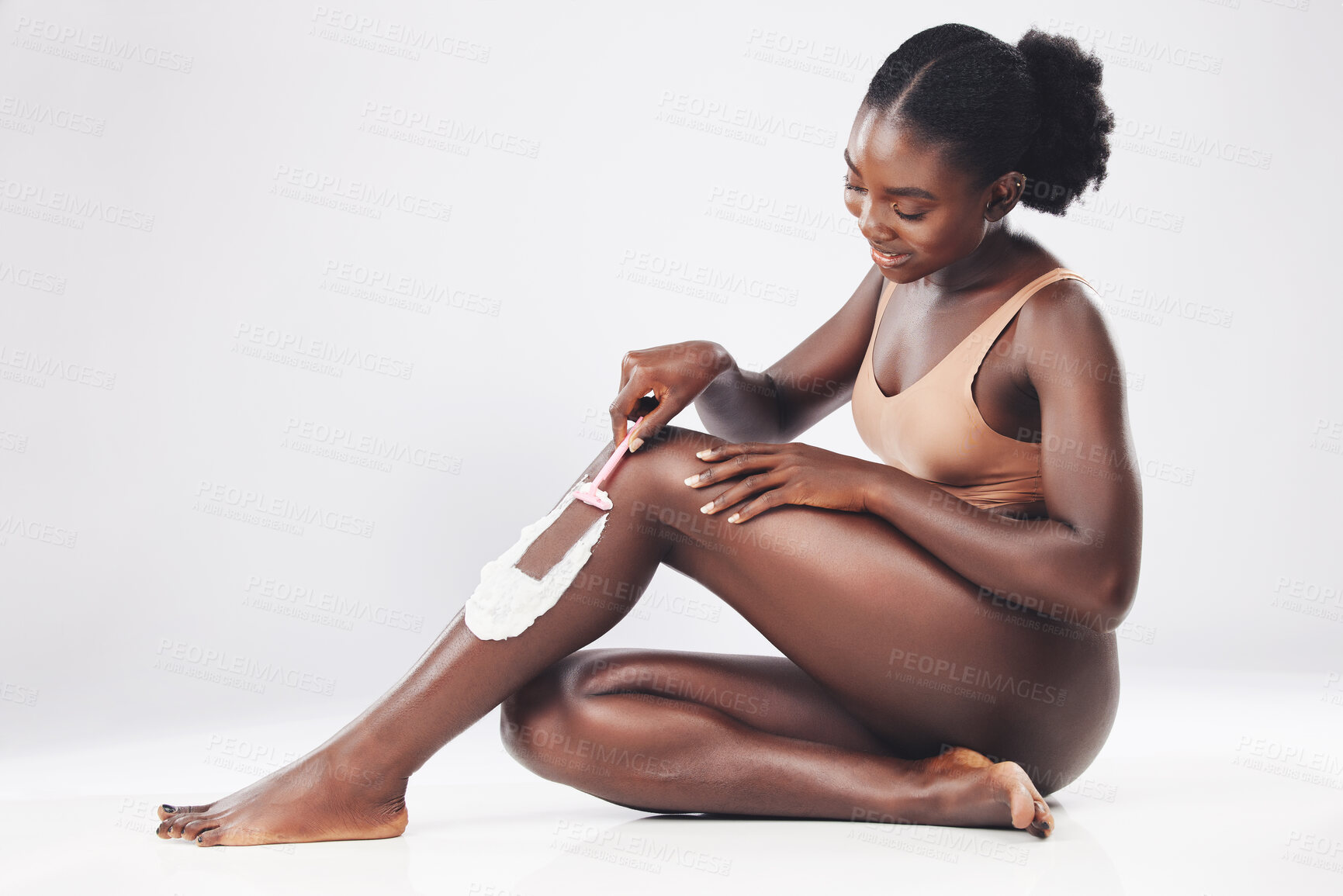 Buy stock photo Grooming legs, shaving cream epilation and black woman model busy with body hygiene and skin cleaning. Beauty, cosmetic and wellness of a person from Kenya shave and care with lotion and soap