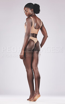 Buy stock photo Body, underwear and black woman with beauty, wellnessand health against a white mockup studio background. Thinking, healthy and African girl model in beige for slimming, skin and lifestyle care