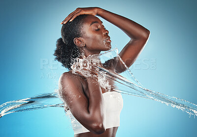 Buy stock photo water splash, black woman and skincare health shower for cosmetic beauty, wellness and body cleaning. African american girl, luxury dermatology lifestyle and body care in blue background studio