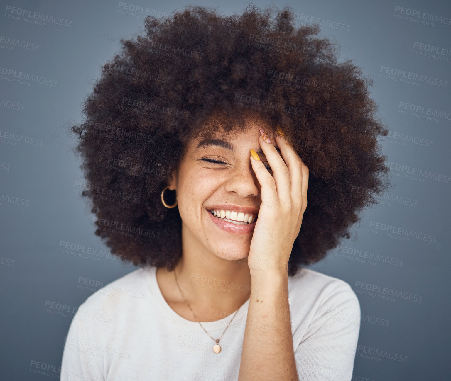 Buy stock photo Comic, happy and black woman with a smile for memory, comedy and fashion against a grey studio background. Hair care, salon and young African girl with an afro while crazy, funny and healthy