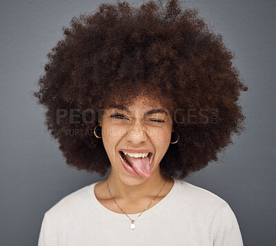Buy stock photo Goofy, face and woman with her tongue out in studio with comic, fun and crazy facial expression. Silly, funny and portrait of happy girl model from Puerto Rico standing and posing by gray background.