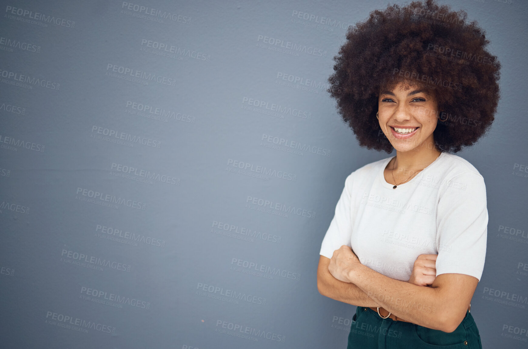 Buy stock photo Black woman, afro or arms crossed by advertising space on grey studio background, business marketing mockup or promotion mock up. Portrait, smile or happy creative designer and about us branding logo