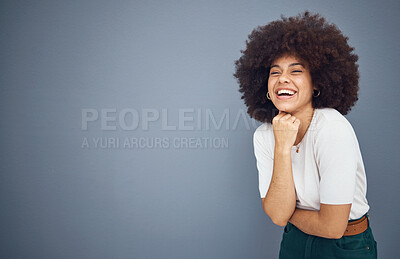 Buy stock photo Relax, happy and black woman with natural hair in studio laughing at a funny joke with mockup space. Smile, happiness and young goofy African girl with an afro enjoying comedy, comic and freedom 
