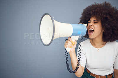 Buy stock photo Studio, megaphone and angry black woman shouting and protesting for change, freedom or democracy. Loudspeaker, bullhorn and speech of young female using voice, screaming in protest for justice.
