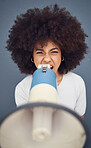 Woman, megaphone and shout for protest, opinion and voice for social justice against a studio background. Speaker, latino woman and portrait girl speaking protest, strike and marketing a announcement