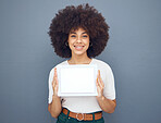 Marketing, advertising and woman with paper for business, sales and corporate news against a grey mockup studio background. Announcement, space and girl with a poster for service with mockup