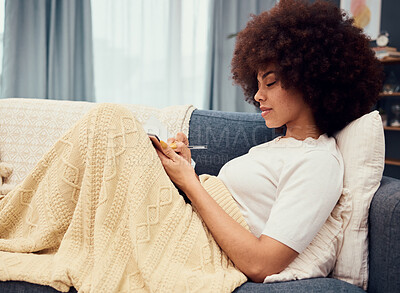Buy stock photo Woman, book and writing on sofa for planning, afro or goal in living room in home. Girl, notebook and paper with smile, happy and thinking of motivation, strategy or vision for life, career or idea