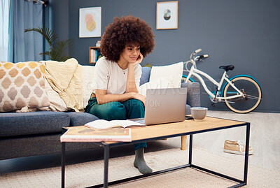 Buy stock photo Laptop, education and learning with a black woman student watching an online video while studying in a living room. Computer, study and homework with a female university or college pupil in her home
