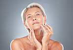 Senior, skincare and beauty of a model holding her healthy face ready for wellness and skin treatment. Portrait of a calm elderly person from Finland touching smooth body texture after dermatology 