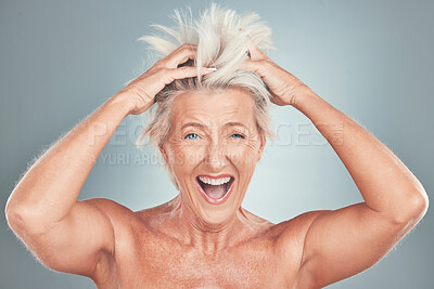 Buy stock photo Crazy, funny and senior woman with hair problem or style issue on a grey studio background. Damage, bad and messy of elderly female mistake with blonde hair loss for advertisement on a backdrop