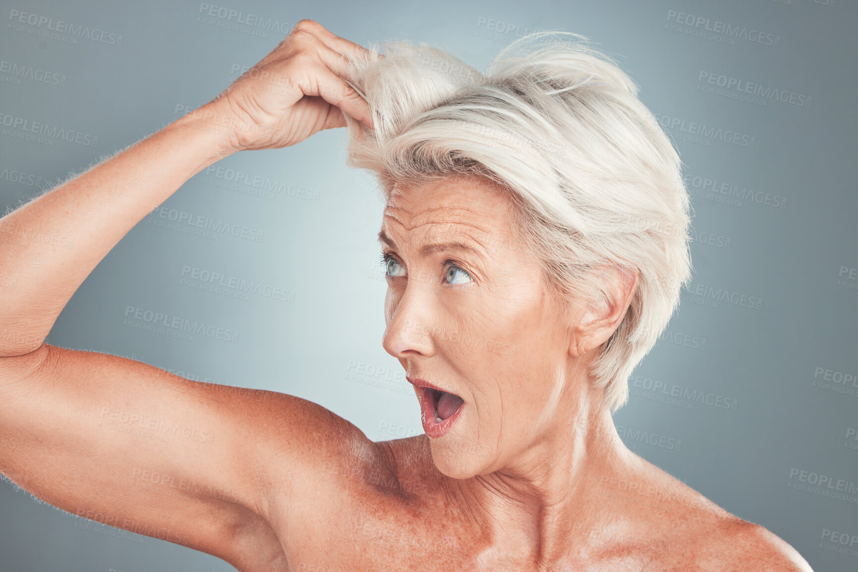 Buy stock photo Elderly woman with surprise, white hair in gray background studio and shocked face at healthy haircut. Short hairstyle in senior age, old lady with hair loss or dermatology skincare aesthetic