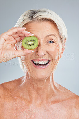 Buy stock photo Kiwi, fruit and wellness of a senior woman with beauty skincare, health and a smile. Portrait of an happy elderly model holding food feeling happiness from healthy lifestyle, nutrition and wellbeing