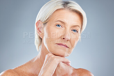 Buy stock photo Face, beauty and skincare with a senior woman in studio on a gray background for antiaging treatment. Cosmetics, luxury and natural with a mature female posing to promote a body care product