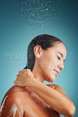 Buy stock photo Water splash, cleaning and shower of a young model woman holding her back to clean with soap. Bathroom hygiene, wellness and beauty of a person morning routine for healthy skin and skincare