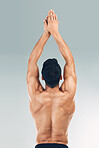 Sports man, stretching back muscle for start of swimming dive in fitness workout on gray studio background. Bodybuilder spine with power pose, strong athlete stroke and exercise training health