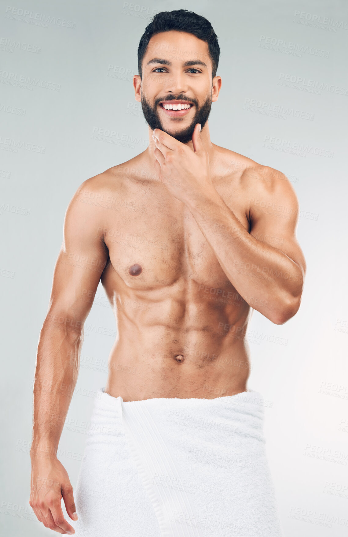 Buy stock photo Skincare, beauty and portrait of man with towel in studio on white background. Wellness, body care and male model pose for for facial cleanse, skincare products and hygiene for washing and cleaning