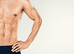 Muscular, man and fitness in studio zoom in for health, wellness and muscle in studio background with mockup space. Stomach, skincare and guy model torso for six pack, beauty and grooming or mock up