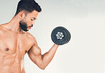 Fitness, muscle and man with dumbbell for weightlifting and body workout, strong and bicep against white studio background. Bodybuilder, weight training and strength endurance in exercise mockup.