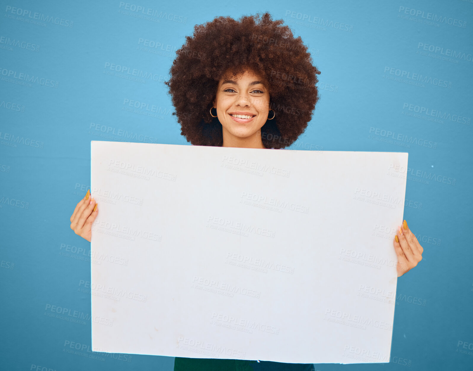 Buy stock photo Advertising, mockup and woman with a poster for marketing, creative business and branding against a blue studio background. Logo, communication and portrait of a girl with a paper for news with space