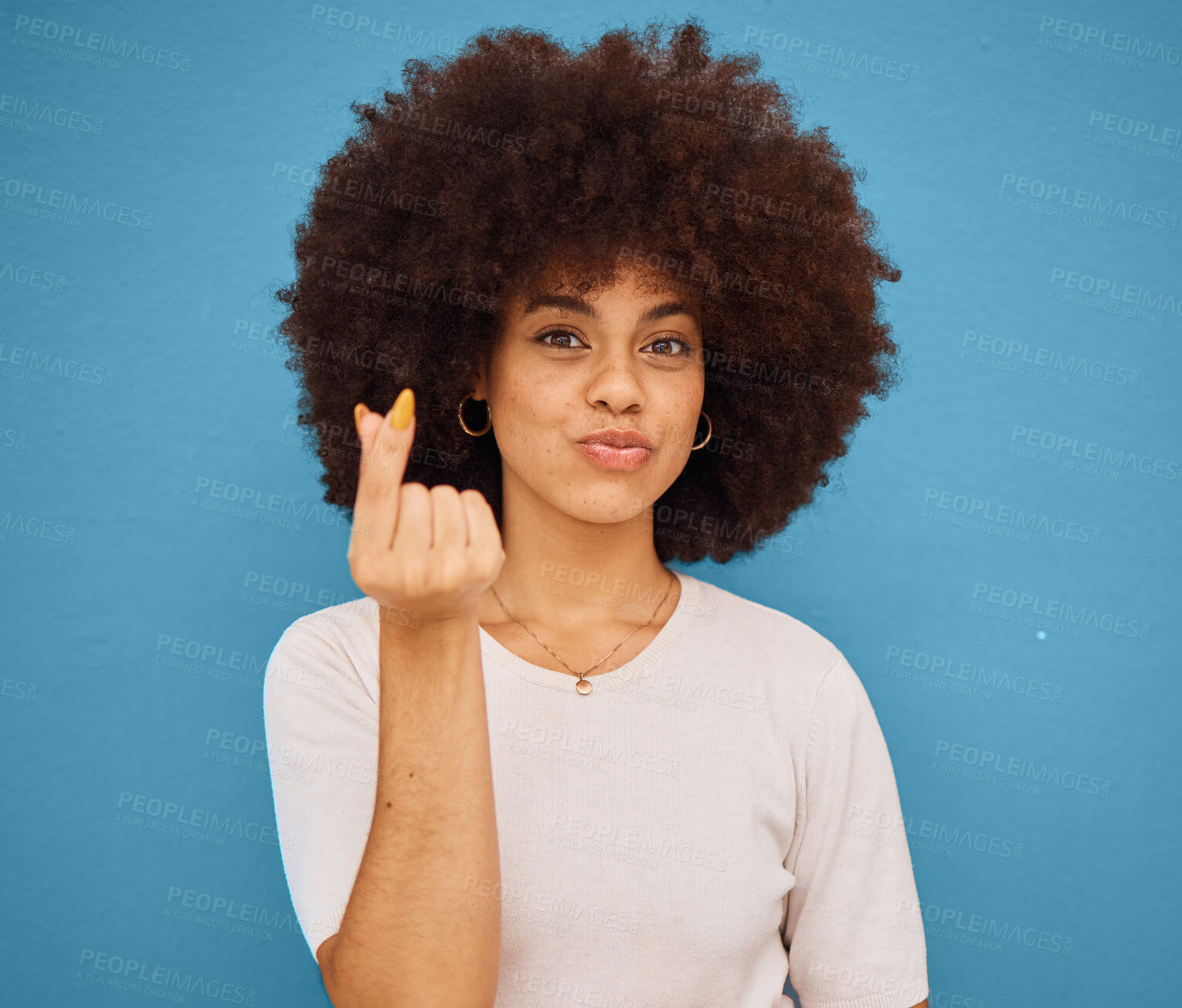 Buy stock photo Hand, korean symbol and portrait of happy woman with an afro from Puerto Rico in the studio. Happiness, care and girl model doing kpop i love you gesture from Korea while isolated by blue background.