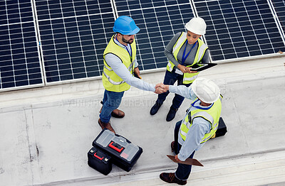 Buy stock photo Handshake, engineering and team working on solar panels for inspection, maintenance or installation. Eco, solar energy and industrial workers shaking hands for a industry deal, agreement or teamwork.