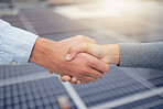 Handshake, welcome and b2b with a business man and woman shaking hands at a solar power plant. Meeting, thank you and collaboration with an employee team in agreement in the energy supply industry