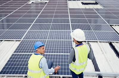 Buy stock photo Solar energy, construction and employees building solar panels in collaboration for sustainability, maintenance and engineering. Teamwork, planning and construction workers talking about clean energy