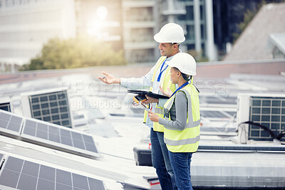 Buy stock photo Engineering, solar panels and team planning a maintenance project outdoor in the city on a rooftop. Solar energy, eco friendly and industrial workers in collaboration working on photovoltaic cells.
