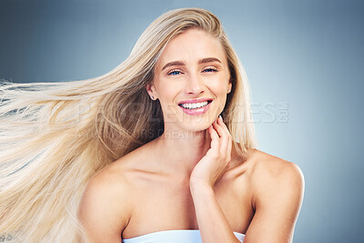 Buy stock photo Beauty, hair care and portrait of happy woman in studio with long, healthy and blond hair. Health, cosmetics and model from Australia with beautiful hairstyle after keratin, botox or salon treatment.