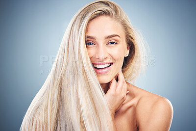 Buy stock photo Hair care, skincare and portrait of a woman with beauty, wellness and luxury dermatology against a blue studio background. Spa, health and happy girl model with facial cosmetology and smile for skin